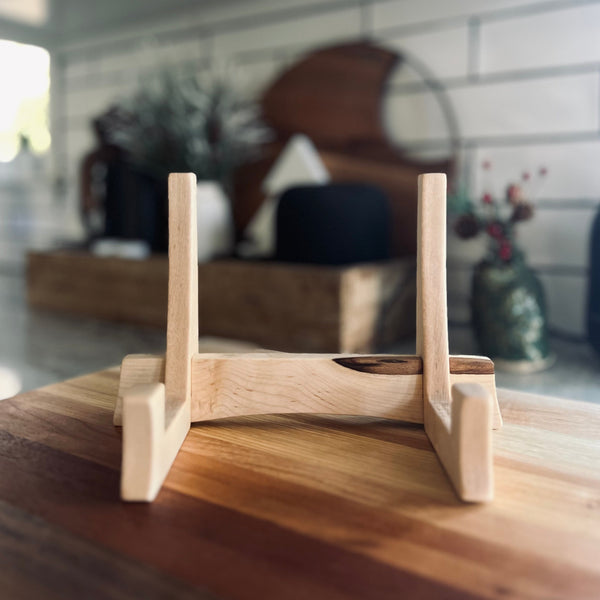 Maple cutting board stand sitting on ombré cutting board